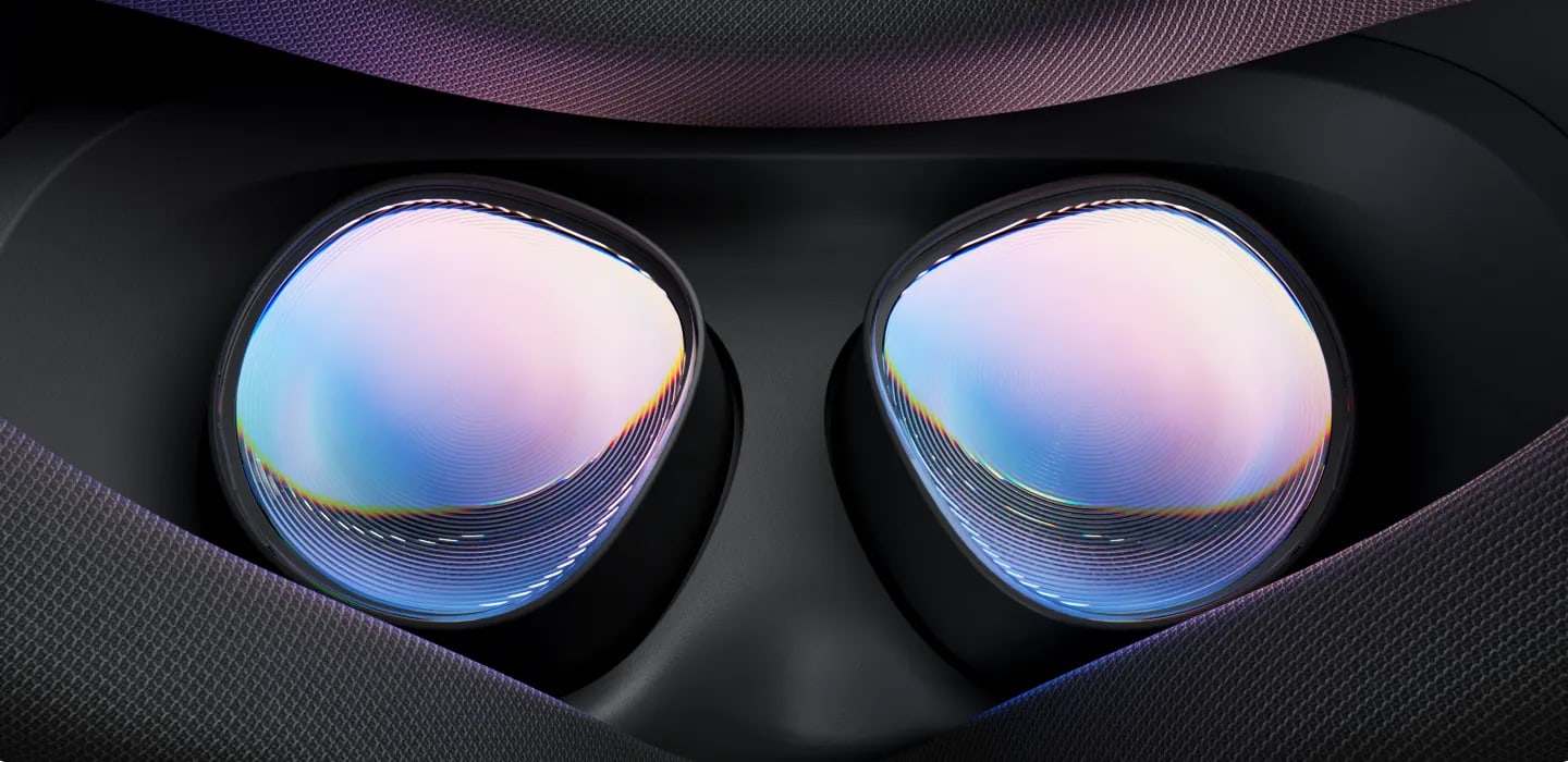 Close-up of the Meta Quest 3S's two Fresnel lenses, their concentric ridges catching the light inside the face opening