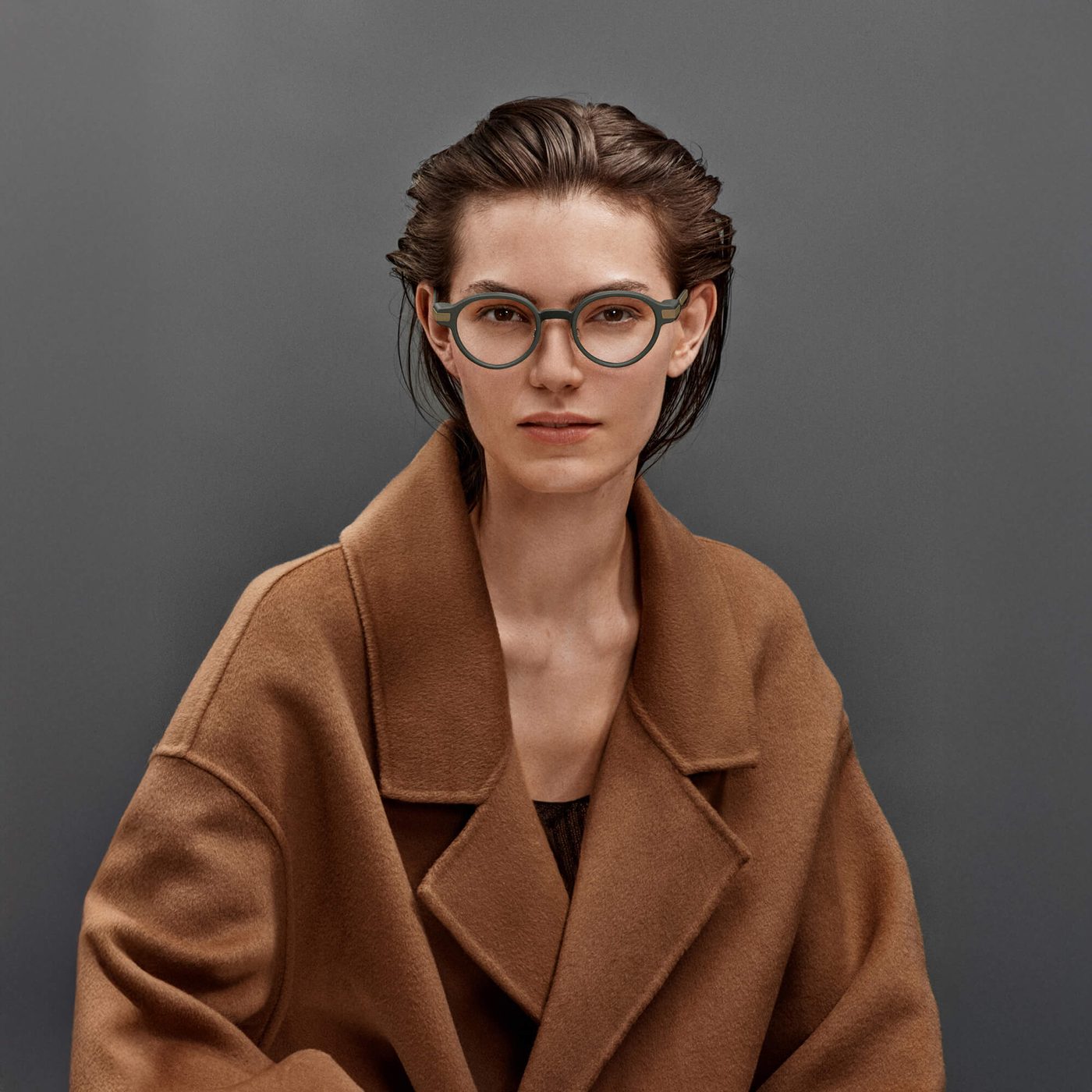 The Even Realities G1 smart glasses in green worn as everyday prescription eyewear