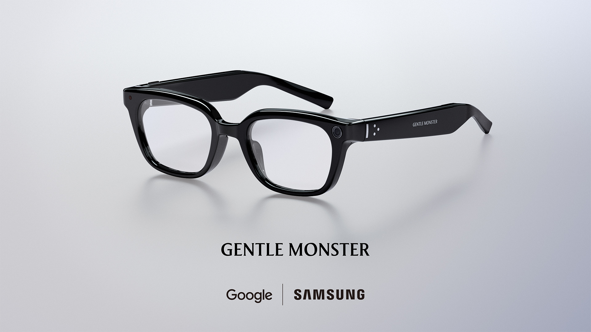 Samsung Intelligent Eyewear in a glossy black Gentle Monster frame, with Google and Samsung branding
