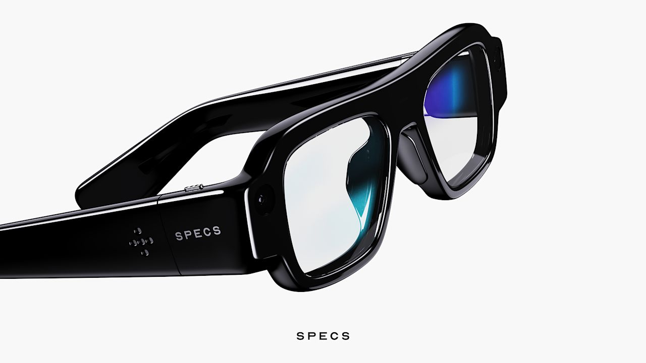 Snap Specs AR glasses in black, shown from a three-quarter angle with the SPECS wordmark on the arm and a camera at each corner of the frame