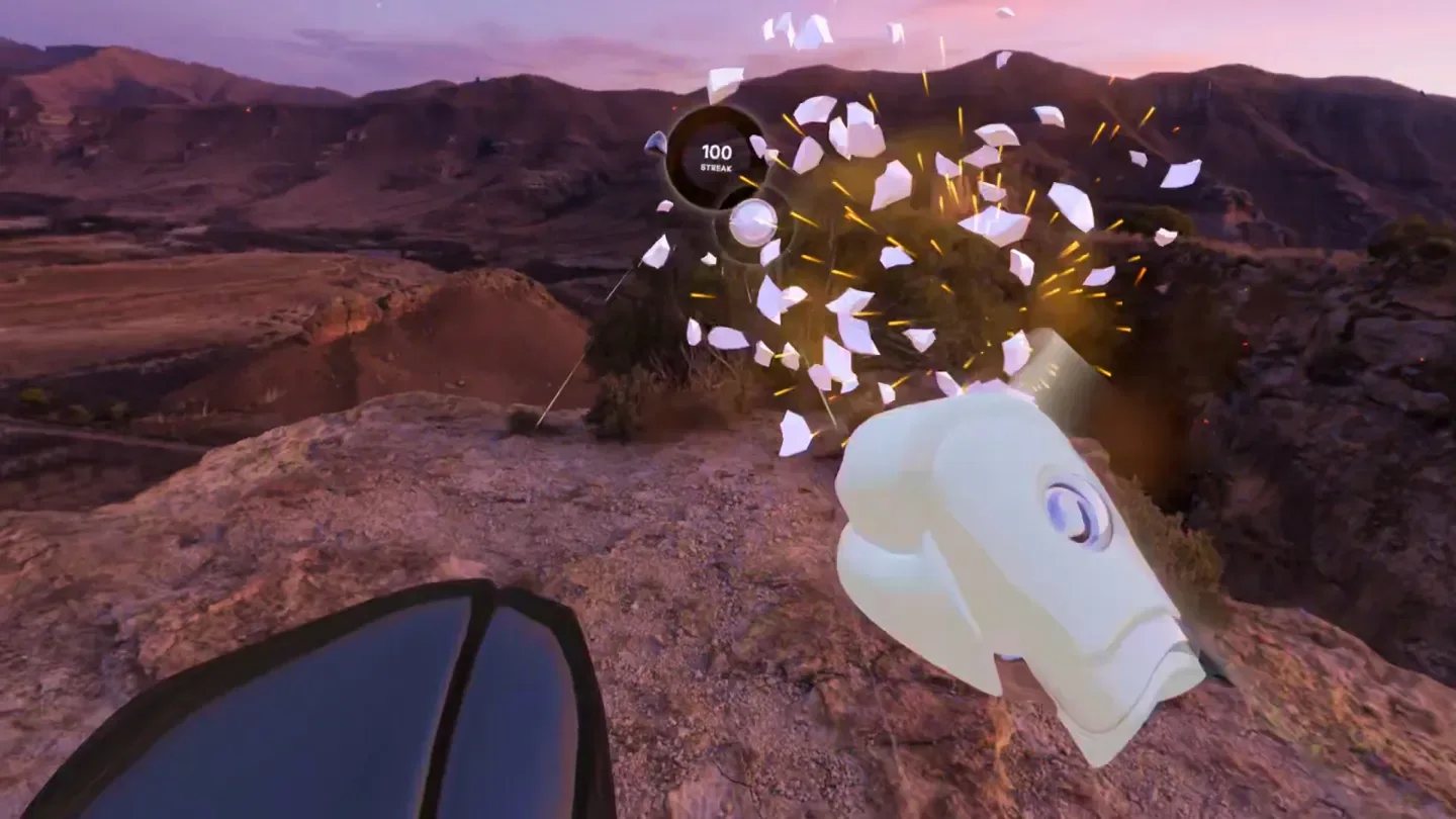 First-person view of a Supernatural boxing workout over a desert canyon at dusk, a white glove smashing a target into fragments beside a counter reading 100 streak