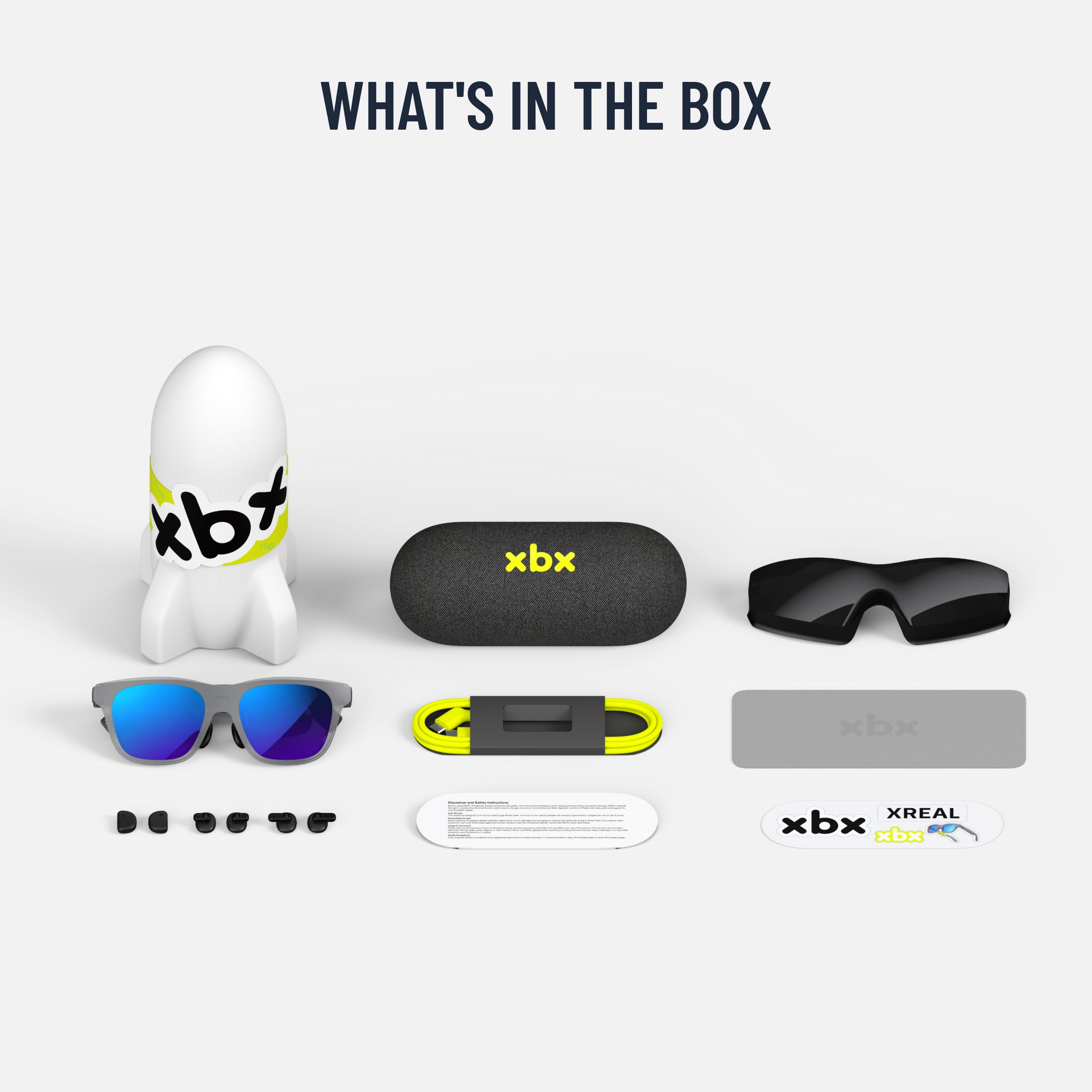 Everything included with the X by XREAL a01+: the glasses, a carrying case, a USB-C cable, a light shield, and nose pads